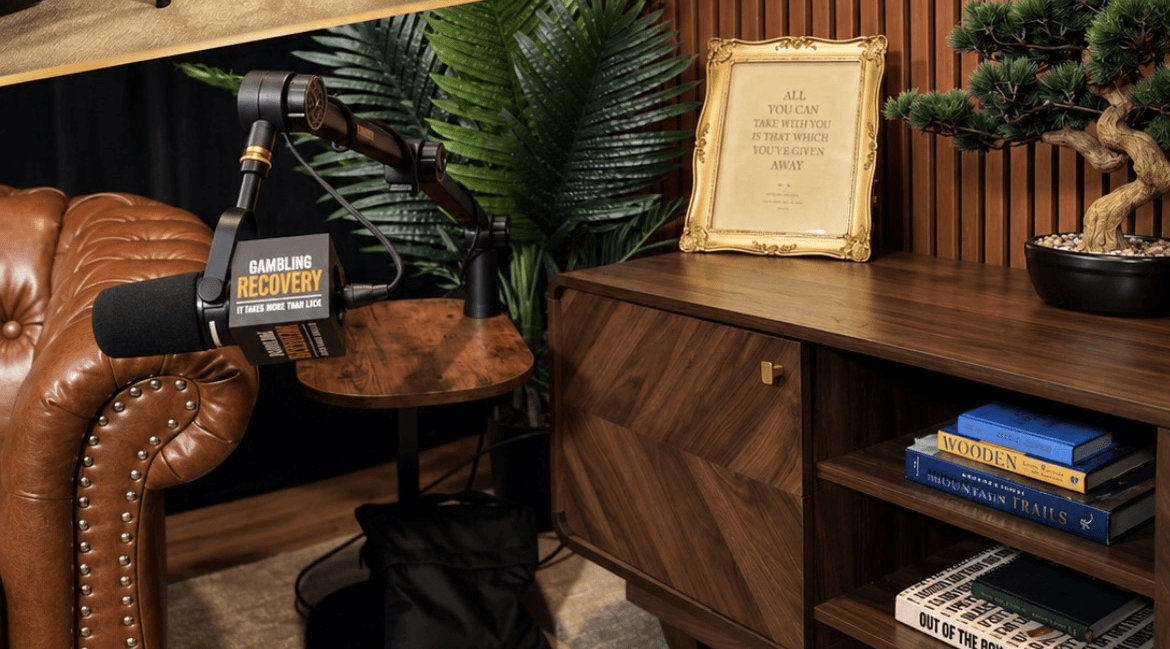 A framed line on the studio sideboard beside the microphone